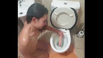 Toilet dildo slut gets slapped and drinks master's pee
